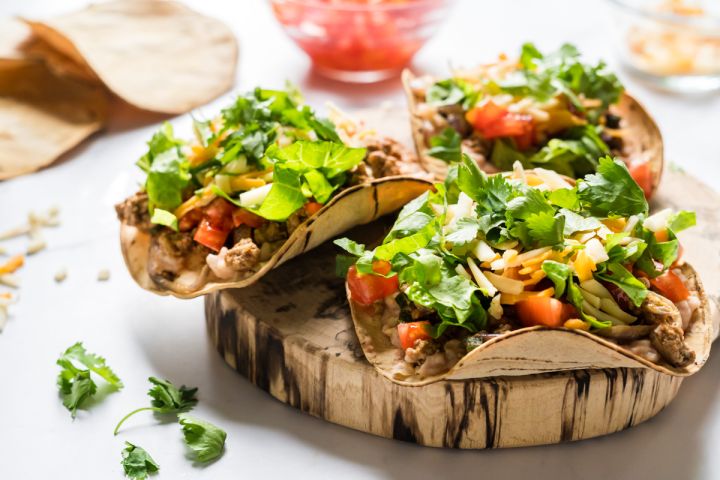 Turkey poblano tostadas with ground turkey, poblano peppers, and onions served on baked corn tortillas.