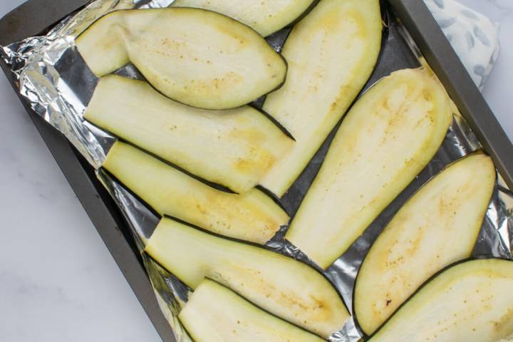Eggplant on a baking sheet.