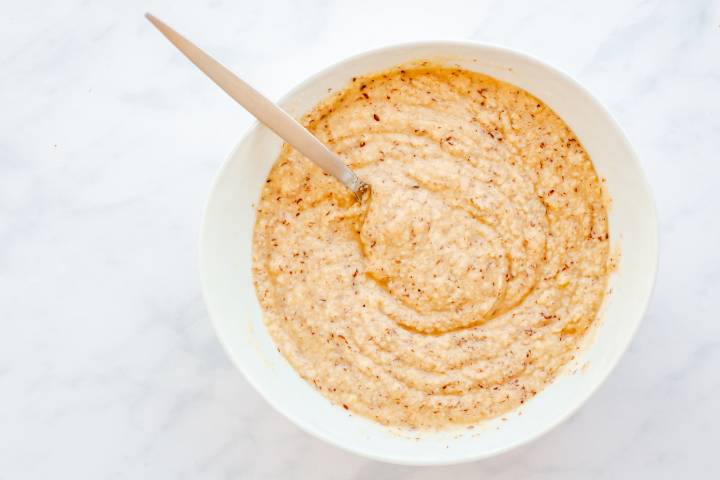 Batter for almond flour pancakes in a bowl.