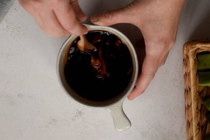 Soy sauce, almond butter, and maple syrup in a small bowl.