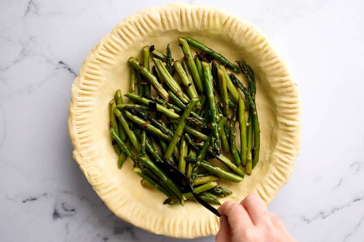 Asparagus spears in a unbaked pie crust.