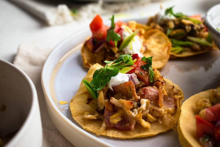 Breakfast tacos with eggs, potatoes, turkey bacon, and cilantro.
