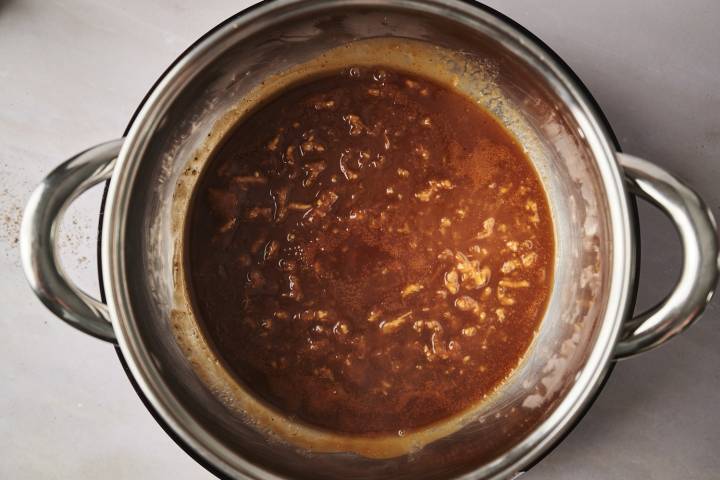 Hawaiian barbecue sauce boiling in a pot.