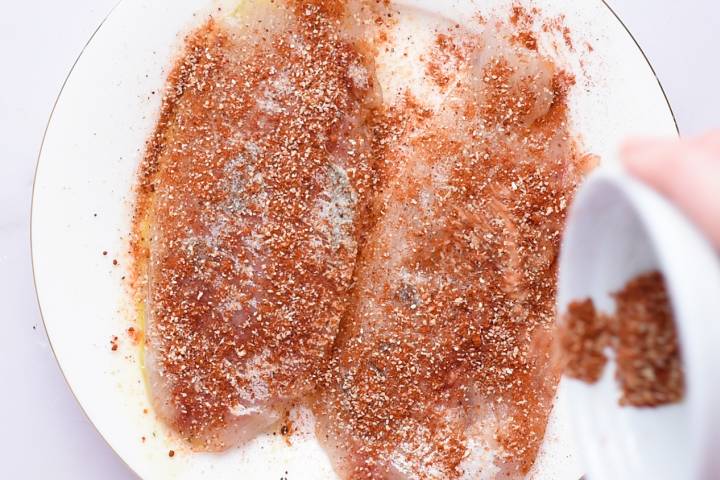 Mahi mahi fillets coated with oil and homemade spice rub,