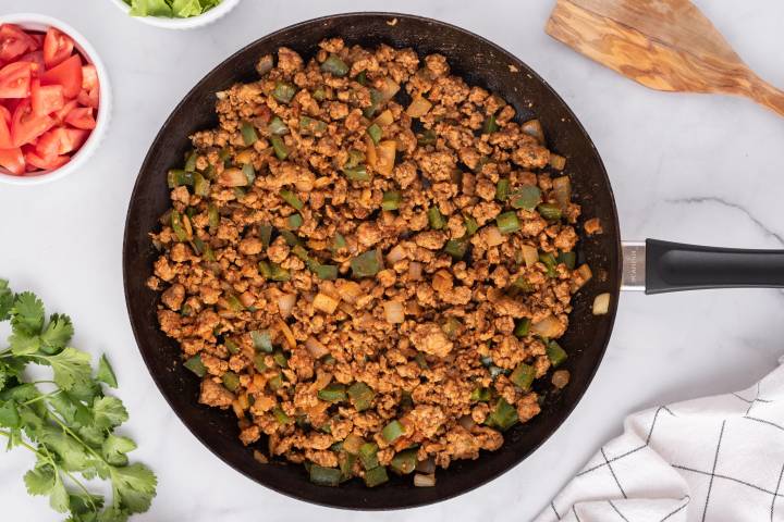 Ground turkey cooked with pepeprs, onions, and taco seasoning.
