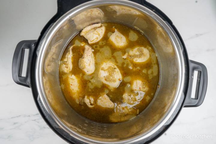 Cooked chicken in salsa in an Instant Pot.