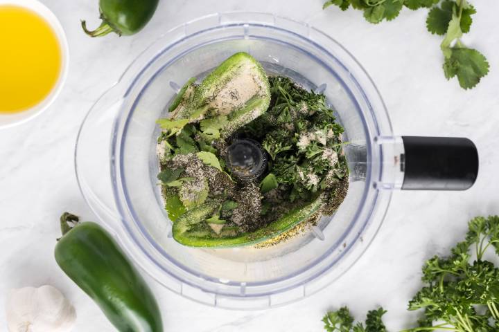 Ingredients for spicy ranch dressing in a food processor.