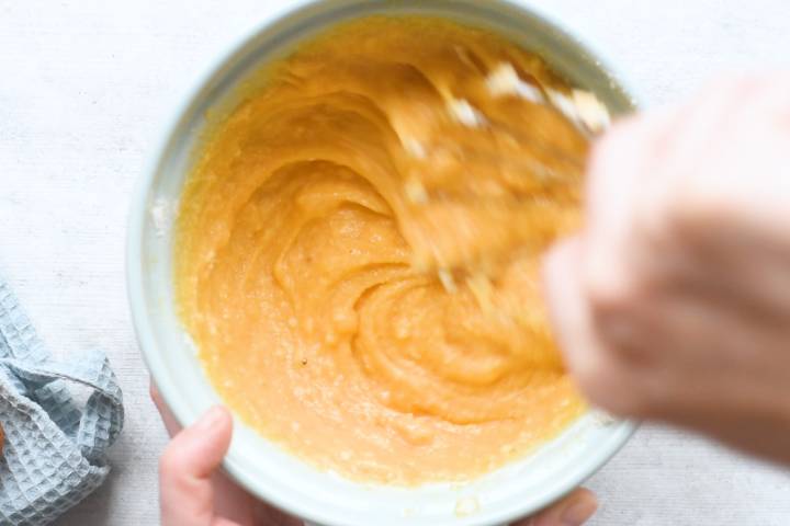 Batter for coconut muffins being stirred.