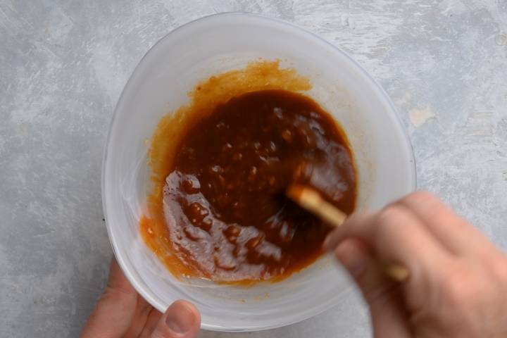 Moo shu stir fry sauce being stirred in a small bowl.