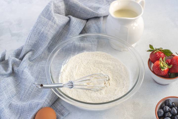 Flour, baking powder, and baking soda in a bowl.