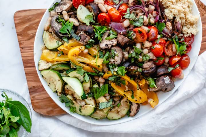 Roasted vegetables couscous with olive oil, balsamic vinegar, lemon juice, and basil.