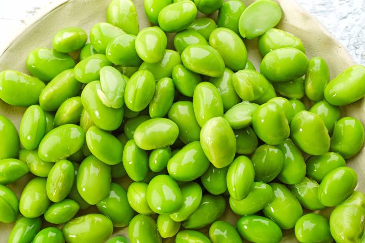 Shelled edamame on a plate.