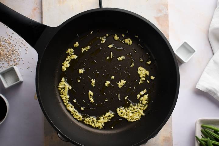 Garlic cooking in a heavy skillet.
