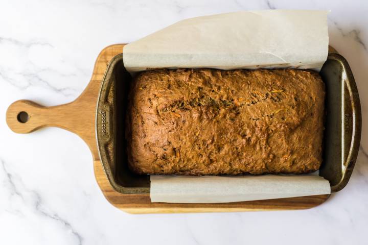 Baked whole wheat zucchini and carrot bread in a bread pan.