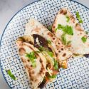 BBQ Portobello mushroom quesadillas with zucchini, red onions, mozzarella cheese, and barbecue sauce in a crispy tortilla.