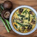 Asparagus, mushroom, and quinoa fritattas in two pie plates.