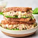 Cabbage tuna salad with canned tuna, yogurt, shredded cabbage, and green onions served on wheat bread.