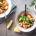 Cóctel de camarones with shrimp marinated in tomato and lime juice served with cilantro.