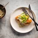 Creamy jalapeno chicken seared in a pan and topped with a jalapeno cream sauce on a plate.