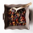 Easy roasted beets with balsamic vinegar and honey in a dish with fresh herbs.