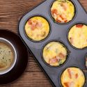 Egg Muffins with ham and cheese in a muffin tin.
