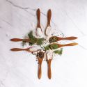 Homemade ranch seasoning in small wooden spoons with dried herbs, buttermilk powder, salt, and pepper.