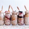 How to make overnight oats including a picture of various flavors of overnight oatmeal in mason jars. 