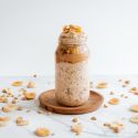 Overnight oatmeal with banana and peanut butter in a glass jar.