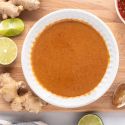 Peanut sauce made with peanut butter, soy sauce, maple syrup, ginger, hot sauce, and rice vinegar in a small bowl.