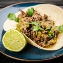 Ground turkey tacos with salsa verde in yellow corn tortillas.
