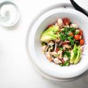 Shrimp Ceviche cured in lime juice with avocado, tomatoes, cucumbers, and red onion.