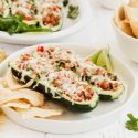 Turkey Fajita Zucchini Boats with ground turkey, pepper, onions, and tomatoes in hollowed out zucchini with melted cheese.