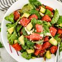 Watermelon avocado salad with cilantro and onions in a honey lime dressing.