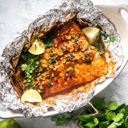 Cilantro lime salmon cooked in foil with garlic, lime juice, cilantro, and honey.