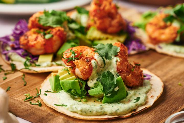 Mexican seafood tacos made with shrimp, avocado, and cilantro lime sauce. 
