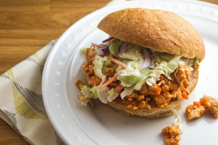 Buffalo chicken sloppy joes with ranch coleslaw in a hamburger roll.