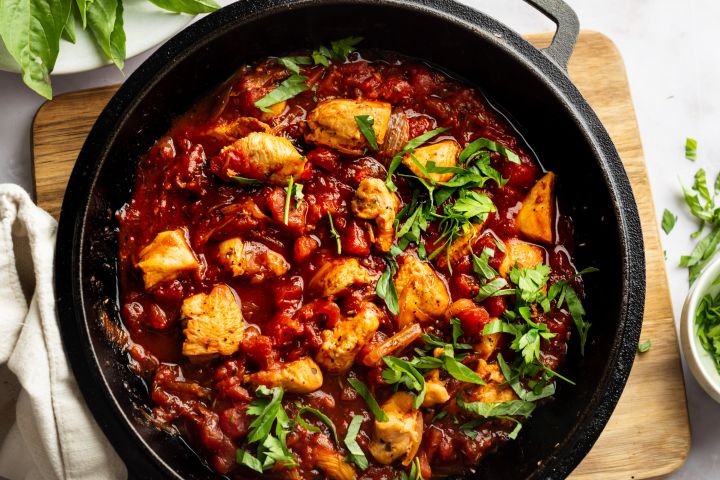 Chicken Fra Diavolo with chicken breast pieces cooked in a spicy tomato sauce with fresh basil.