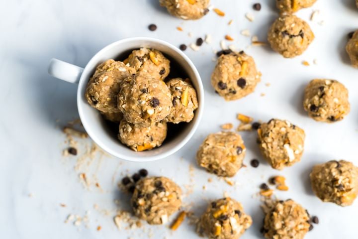 Chocolate peanut butter pretzel energy balls with oats, pretzels, and chocolate chips rolled into small balls.