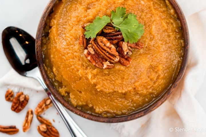 Slow cooker butternut squash served in a wooden bowl.