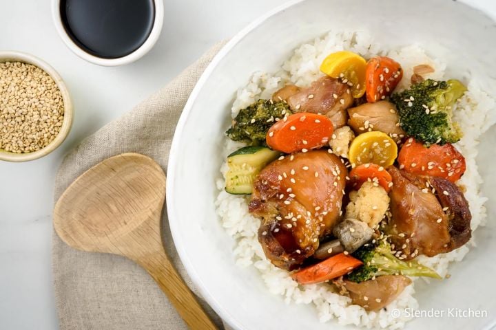 Slow Cooker Chicken Teriyaki and Vegetables with rice and chopsticks.