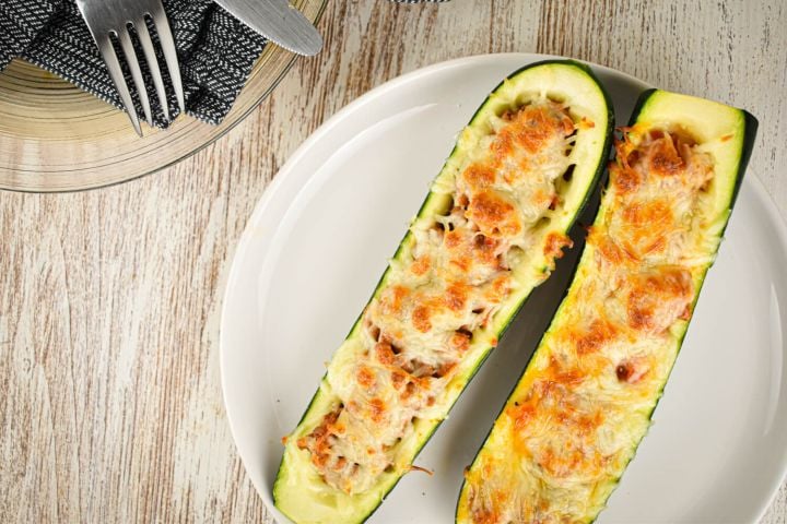 Zucchini and Ground Turkey Pizza Boats in a glass baking dish.