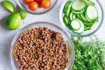 Ingredients for lentil meatballs including canned lentils, tomato paste, parsley, onion, flour, and spices.