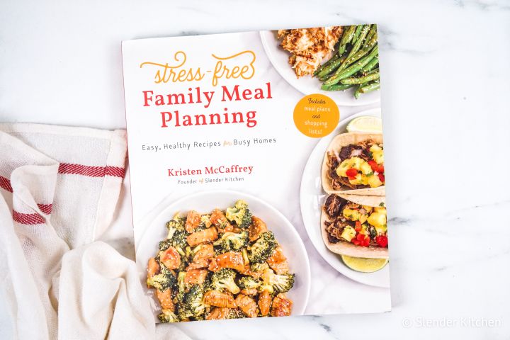 Stress Free Meal Planning cookbook and a cloth napkin.
