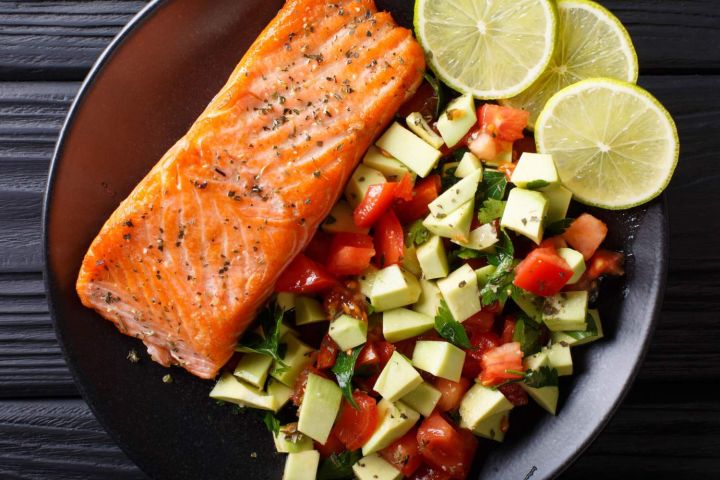 Healthy Salmon recipe with honey lime dressing and avocado salsa.