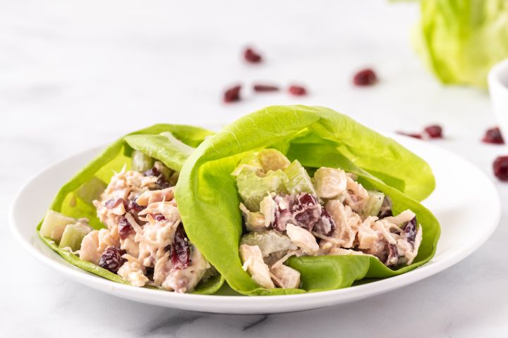 Chicken salad lettuce wraps with homemade cranberry and celery chicken salad wrapped in a butter lettuce leaf.