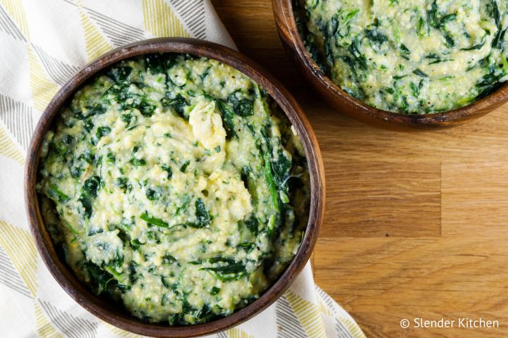Creamy spinach polenta in a bowl with creamy cornmeal and spinach.