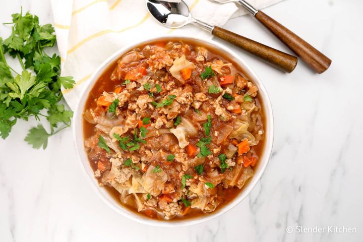 Healthy cabbage soup with cabbage, ground turkey, tomatoes, and cauliflower rice in a bowl.