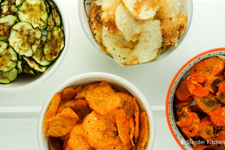 Microwave veggie chips with carrots, zucchini, sweeet potato, and potato in a bowl.