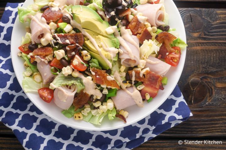 Southwestern Turkey and bacon salad with corn and black beans in a bowl.
