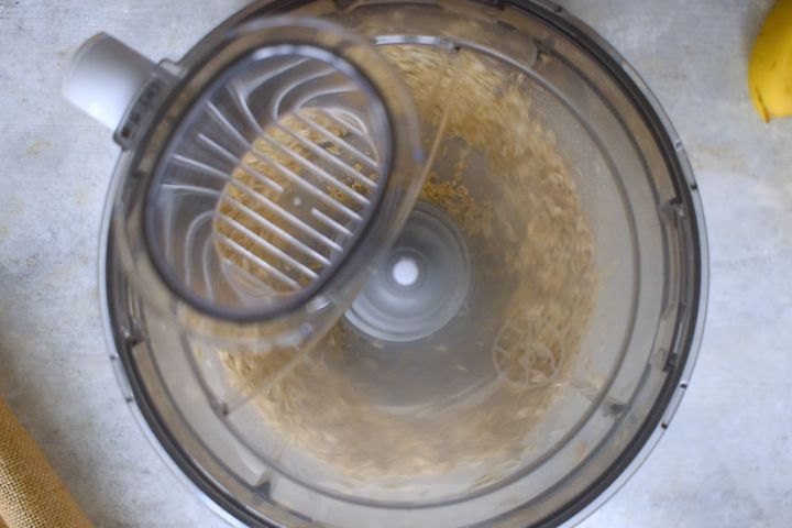 Oatmeal being pulsed in a food processor into flour.